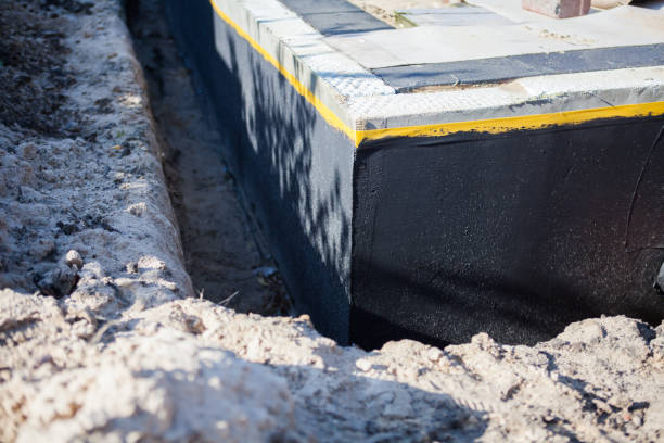 Professional Emergency Waterproofing technician working in Rockville Centre, NY